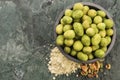 Pile of wasabi coated peanuts in bowl