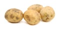 Pile of brown washed potatoes isolated.