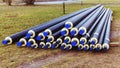 A pile of black plumbing pipes with thermal insulation Royalty Free Stock Photo