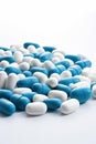 Pile of white-blue medical capsules. Blue white pills capsul.