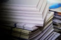 Pile of white books and journals on the table in the library Royalty Free Stock Photo