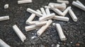 Pile of white cigarettes on a pavement Royalty Free Stock Photo