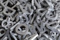 Pile of white metal alphabet characters cutted by waterjet machine