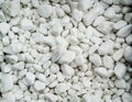 Pile of white naturale stones used to decorate the garden or parts of the house indoor or outdoor