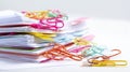 Stack of papers with colorful paperclips close up Royalty Free Stock Photo