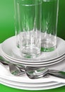 Pile of white plates, glasses Royalty Free Stock Photo