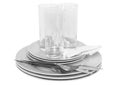 Pile of white plates, glasses, forks, spoons. Royalty Free Stock Photo