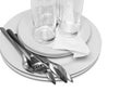 Pile of white plates, glasses, forks, spoons. Royalty Free Stock Photo