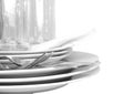 Pile of white plates, glasses, forks, spoons. Royalty Free Stock Photo