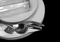 Pile of white plates, glasses, forks, spoons. Royalty Free Stock Photo