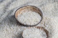 a pile of white rice on the kitchen table in a wooden plate Royalty Free Stock Photo