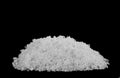 A pile of white snow isolated on a black background Royalty Free Stock Photo
