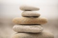Pile of white stones in the foreground zen-like on the beach Royalty Free Stock Photo