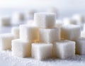 A pile of white sugar cubes on a white background