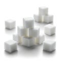A pile of white sugar cubes on a white surface Royalty Free Stock Photo