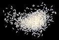 pile of white uncooked rice grains, lying flat. Isolated on black background Royalty Free Stock Photo