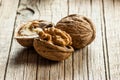 Walnut kernel with thin shell on wooden vintage rustic backdrop. Fresh walnuts background concept Royalty Free Stock Photo