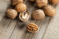 Walnut kernel with thin shell on wooden vintage rustic backdrop. Fresh walnuts background concept Royalty Free Stock Photo