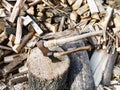 Pile of wood, deck for chopping firewood, two axes Royalty Free Stock Photo