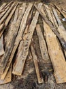 A pile of wood that is laying on the ground Royalty Free Stock Photo