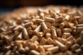 Pile of wood pellets on table. Ecologic fuel made from biomass. Renewable energy source