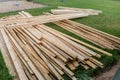 Pile of wooden boards in the sawmill, planking. Wood lumber stack. Construction from ecological material. Industry. Delivery and