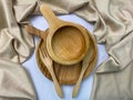 Pile of wooden cutlery, wooden plates, and wooden bowls Royalty Free Stock Photo