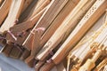 A pile of wooden folding fan for wedding souvenir with empty name tag, close-up Royalty Free Stock Photo