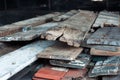 A pile of wooden planks from old houses stacked for burning