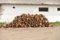 Pile of woods near the wall of an old house