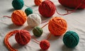 A pile of yarn balls in various colors including green, orange, and red. Royalty Free Stock Photo
