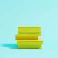 Pile of yellow books on blue background for copy space