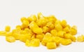 A pile of yellow corn grains against white background Royalty Free Stock Photo