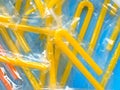 Pile of yellow drinking straws on a blue background Royalty Free Stock Photo