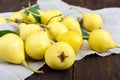 A pile of yellow pears scattered on a dark wooden table. Royalty Free Stock Photo