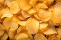 A Pile of Yellow Potato Chips on Table Royalty Free Stock Photo