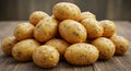 Pile of Yellow Potatoes on Rustic Wood Table Surface Royalty Free Stock Photo