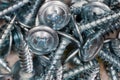 Pile of zinc plated cross recessed sheetmetal screws, close-up