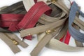Pile zippers on a white background Royalty Free Stock Photo