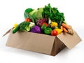 Piled high with freshness. Studio shot of a cardboard box filled with fruit and vegetables. Royalty Free Stock Photo