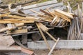 Piled in a pile of debris, pieces of boards