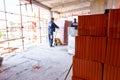 Piled resources of red blocks, packed in background