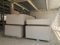 Piled sheets of drywall at the construction site. Stacked plasterboard sheets. Gypsum cardboard Royalty Free Stock Photo