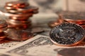 Piled up dollar coins, banknotes in the background. Half dollar on the right side. USD currency of the United States of America. Royalty Free Stock Photo