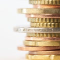 Piled up euro coins on table Royalty Free Stock Photo