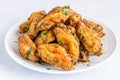 Piled Up Fried Chicken Wings on a White Plate Royalty Free Stock Photo