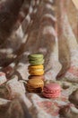 Piled up macaroons close up, vertical