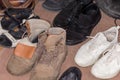 Pile of the various old worn footwear, fragment close-up Royalty Free Stock Photo