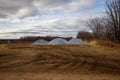 Piles of agricultural lime crushed limestone ready to be spread on the field to neutralize soil acidity and promote healthy plan Royalty Free Stock Photo