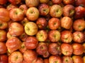 piles of apples on supermarket